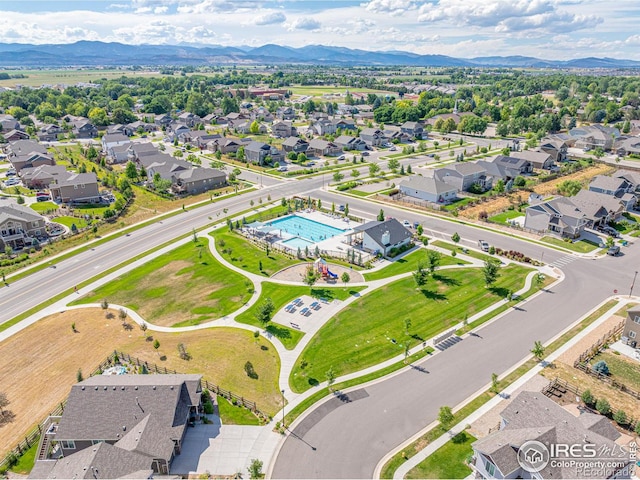 birds eye view of property with a mountain view