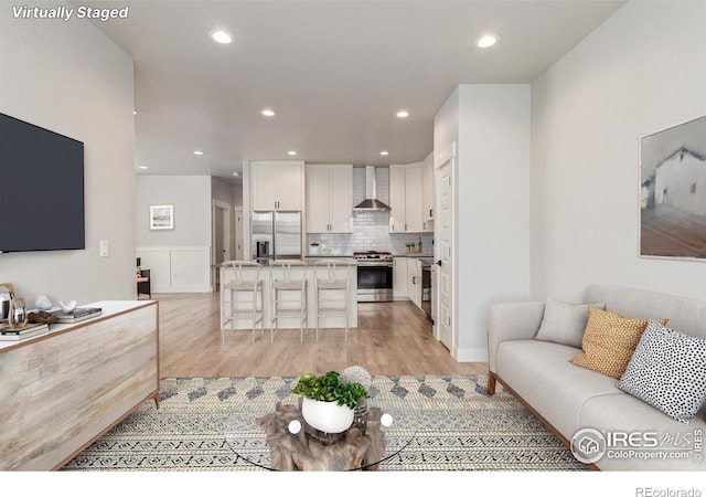 living room with light hardwood / wood-style flooring