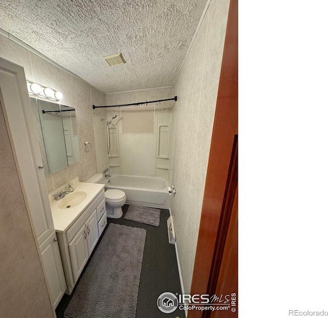 full bathroom featuring visible vents, toilet, bathtub / shower combination, a textured ceiling, and vanity