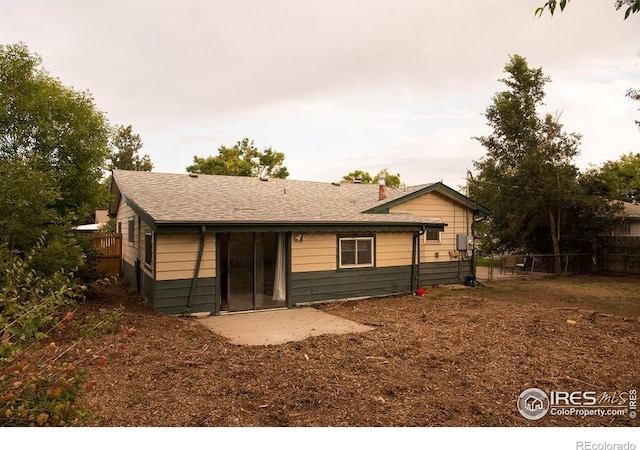 back of property featuring fence