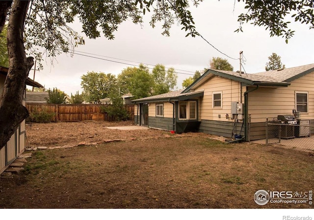 view of side of home featuring fence private yard