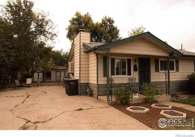 6213 Gray St, Arvada, CO 80003 - bungalow-style home featuring a chimney