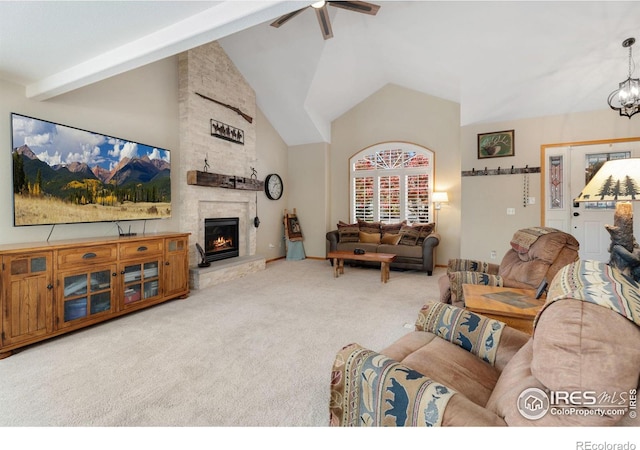 living room with carpet flooring, ceiling fan with notable chandelier, beam ceiling, and a fireplace