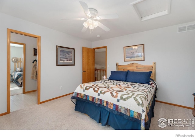 bedroom featuring ceiling fan and light carpet