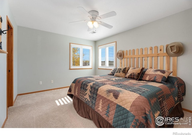 carpeted bedroom featuring ceiling fan