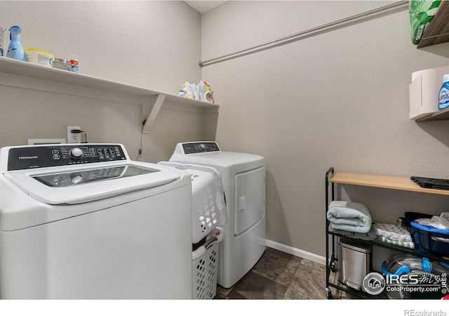 clothes washing area with independent washer and dryer