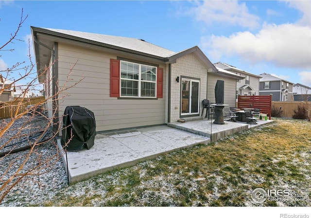 back of house featuring a yard and a patio area