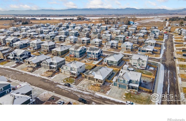 drone / aerial view featuring a mountain view