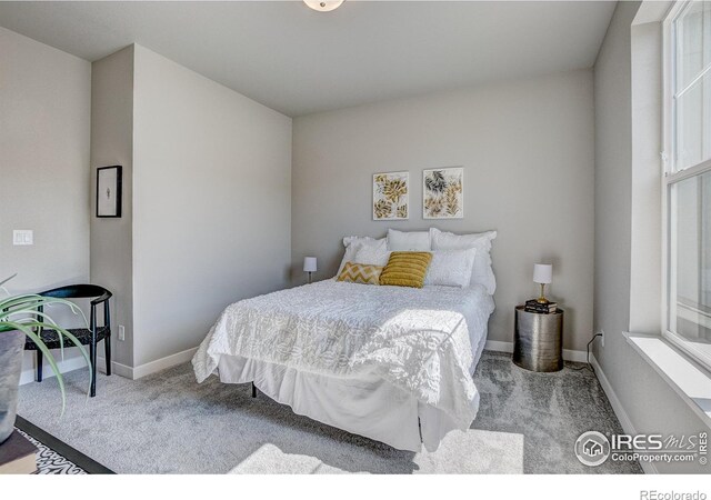 bedroom featuring light carpet