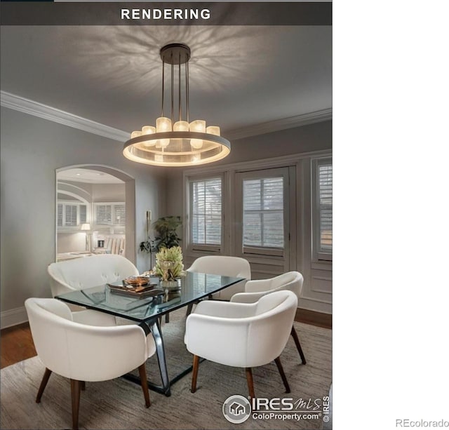 dining room featuring hardwood / wood-style floors, ornamental molding, and a notable chandelier