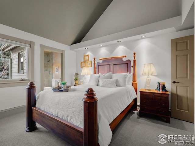 bedroom with light carpet, ensuite bathroom, and high vaulted ceiling