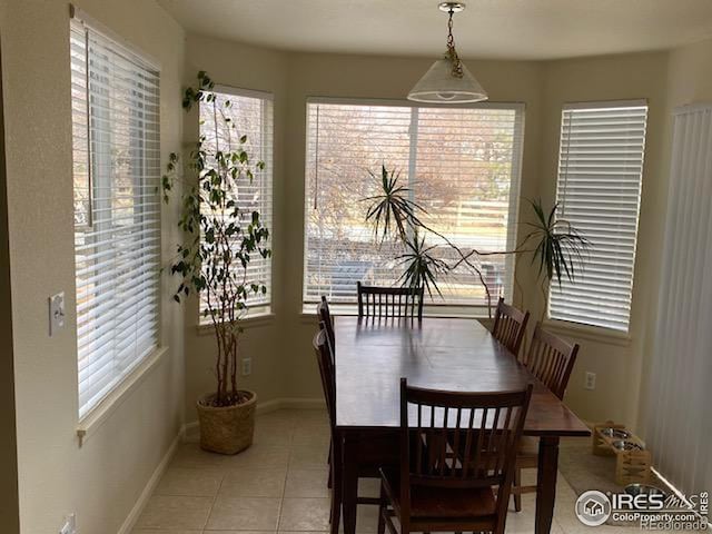 dining area with light tile patterned flooring