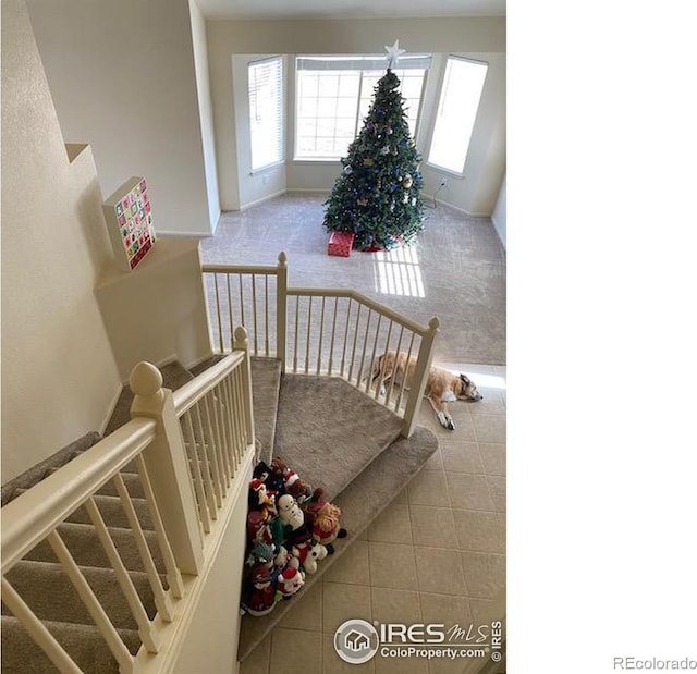 stairway featuring tile patterned floors