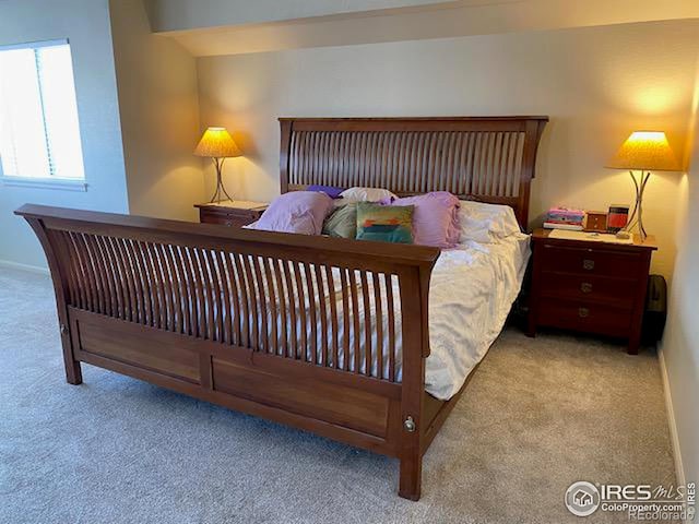 bedroom with light carpet