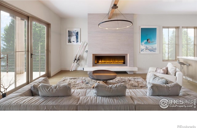 living room featuring a fireplace and light hardwood / wood-style floors