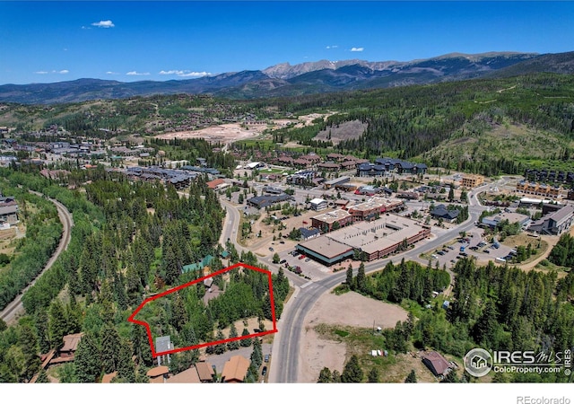 birds eye view of property with a mountain view