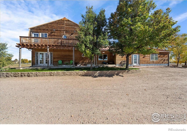 cabin with french doors and a wooden deck