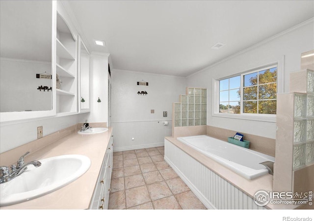 bathroom featuring vanity, a bathtub, and crown molding