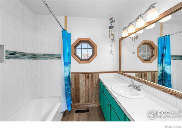 bathroom featuring vanity and shower / tub combo with curtain