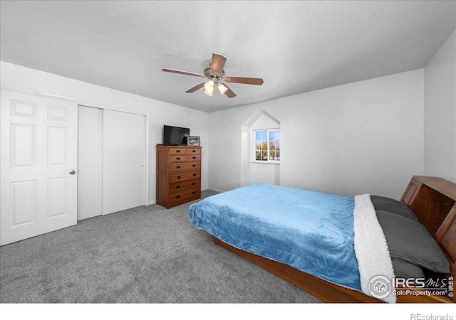 carpeted bedroom with a closet and ceiling fan