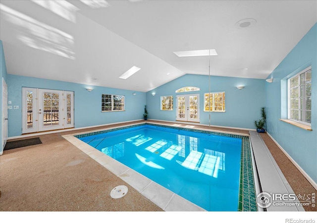 view of pool with a skylight