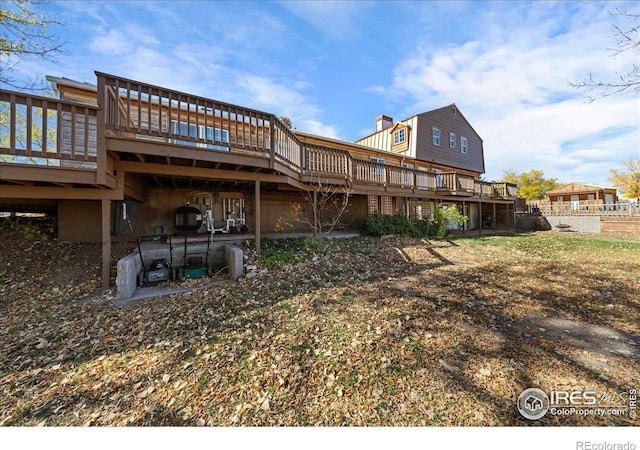 rear view of property with a deck