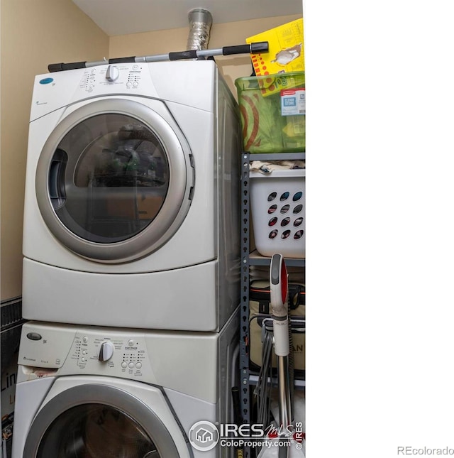 laundry area featuring stacked washer and dryer