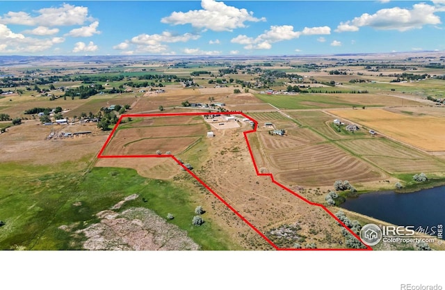 aerial view featuring a water view and a rural view