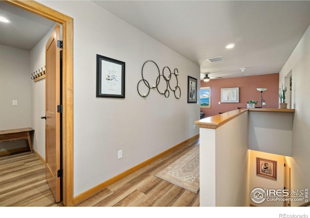 hall with light hardwood / wood-style flooring