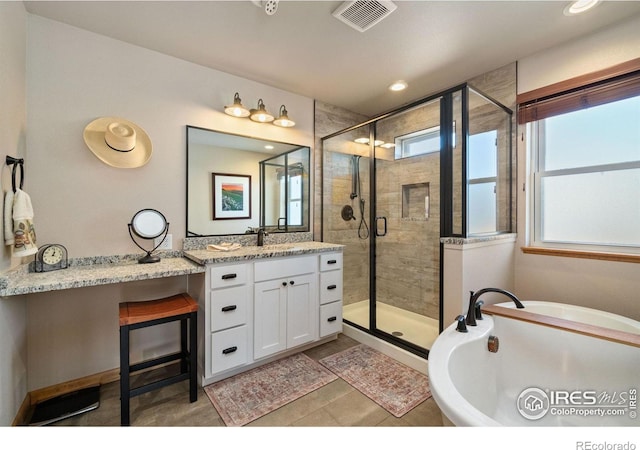 bathroom featuring shower with separate bathtub and vanity