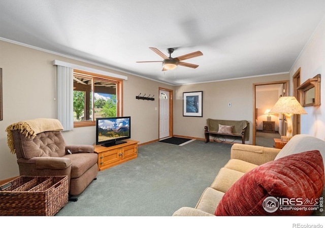 living room with crown molding, carpet, and ceiling fan