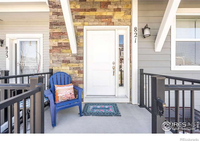 property entrance featuring covered porch