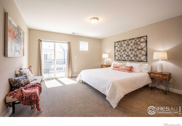 bedroom with access to exterior, baseboards, and carpet flooring