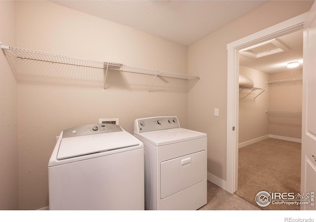 laundry room featuring washing machine and dryer, laundry area, light colored carpet, and baseboards