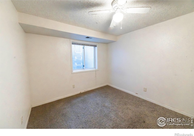 unfurnished room with carpet flooring, ceiling fan, and a textured ceiling