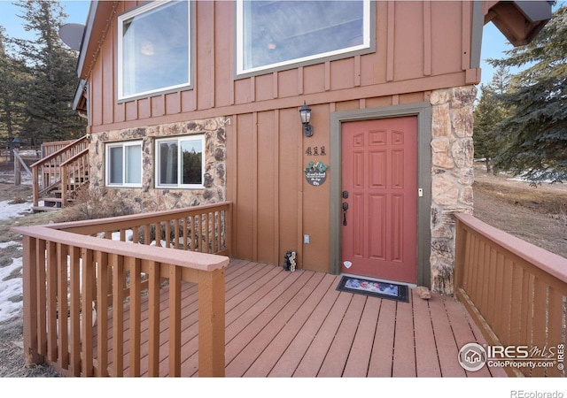 entrance to property with a wooden deck