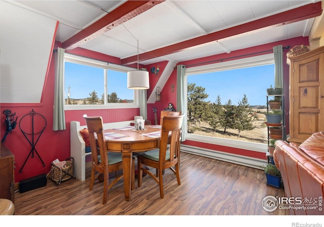 dining space featuring beamed ceiling, dark wood-type flooring, and a baseboard radiator