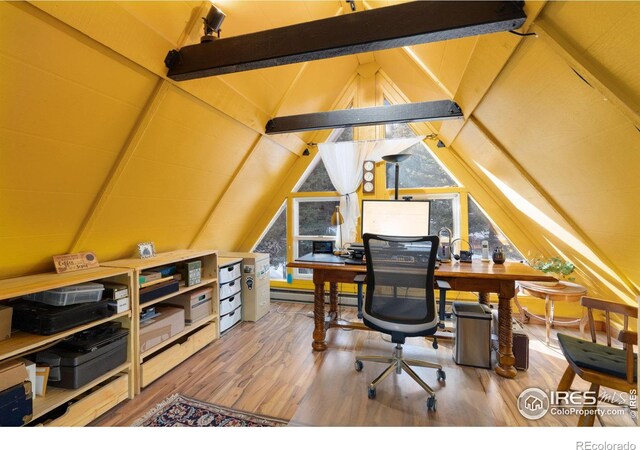 office area featuring hardwood / wood-style flooring and vaulted ceiling with beams