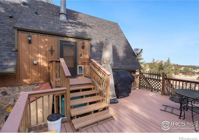 wooden terrace with grilling area