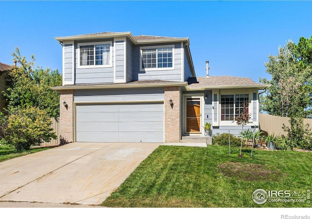 view of front facade featuring a garage and a front yard