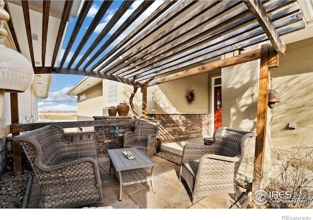 view of patio / terrace with outdoor lounge area and a pergola