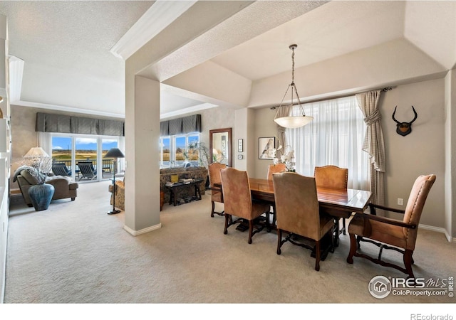 dining space featuring light colored carpet