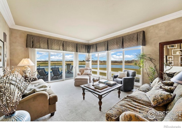 living room with a water view, crown molding, and light colored carpet