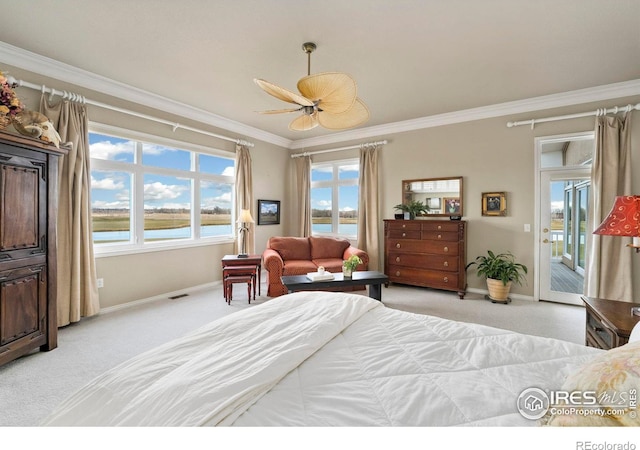 carpeted bedroom with access to outside, ceiling fan, crown molding, and a water view