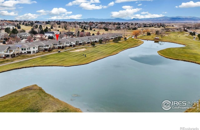 aerial view featuring a water and mountain view