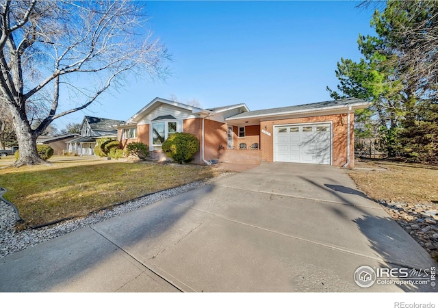 ranch-style house with a garage and a front lawn