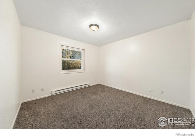 carpeted empty room featuring a baseboard radiator