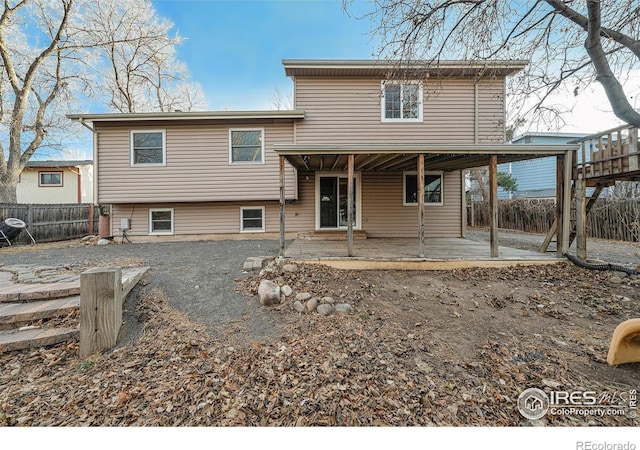 back of house with a patio