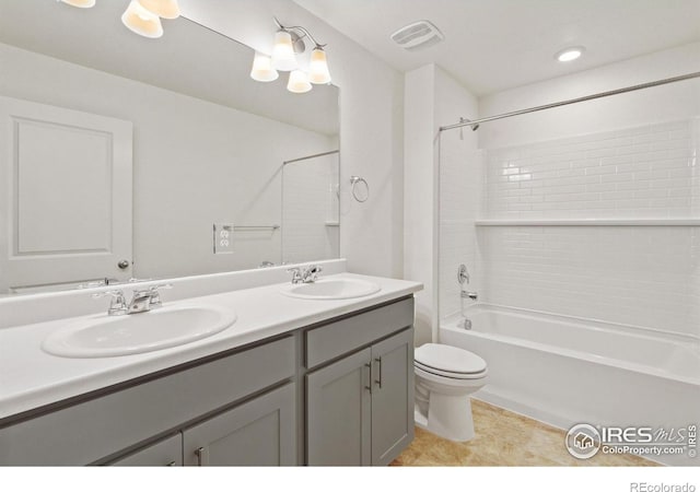 full bathroom with shower / bathing tub combination, vanity, and toilet