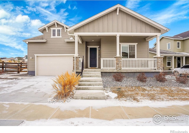 craftsman inspired home with a porch and a garage